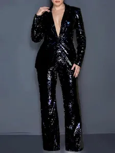 Detailed view of women's shimmering black sequined two-piece blazer and trousers suit