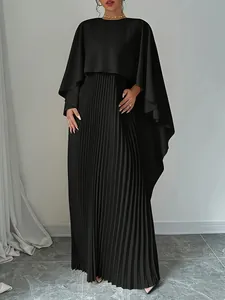 Elegant black two-piece set featuring a batwing sleeve cape and pleated maxi skirt.