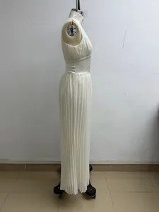 Detailed profile view of a white pleated halter jumpsuit with wide legs on mannequin