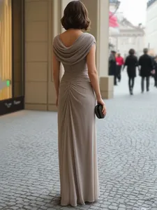 Detailed rear view of elegant taupe cowl neck maxi dress featuring pleated back design