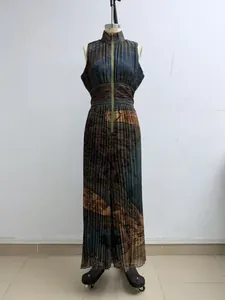 Full view of a sleeveless pleated jumpsuit with a mock neck and abstract print on a mannequin.