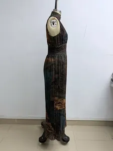 Side profile of a vintage floral pleated sleeveless jumpsuit on a mannequin
