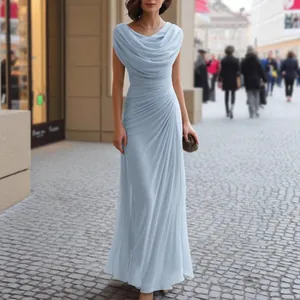 Elegant light blue cowl neck maxi dress with ruched details shown in outdoor street setting.