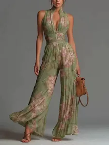 Detailed view of green floral pleated wide-leg jumpsuit with stylish front zipper