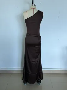 Back view of elegant brown one-shoulder pleated satin maxi dress on mannequin