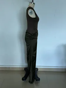 Side view of elegant one-shoulder pleated satin slim fit maxi dress for women