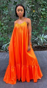 Full-length view of a vibrant orange loose sleeveless camisole maxi dress with ruffled hem