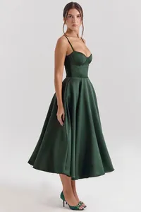 Side view of elegant dark green satin midi dress with corset bodice and flared skirt.