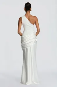 Detail showing the back and ruched fabric of a white one-shoulder satin evening gown