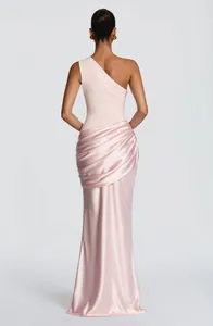 Back view of elegant one-shoulder draped pink satin maxi dress with bodycon fit