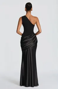 Elegant black one-shoulder dress with a pleated satin skirt seen from the back view.