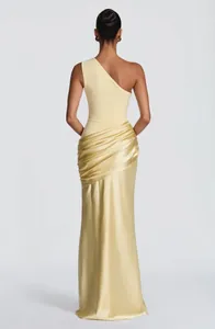 Elegant back view of a pale yellow one-shoulder pleated satin maxi evening dress for women