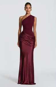 Elegant burgundy one-shoulder evening gown with pleated satin detail and slim fit silhouette