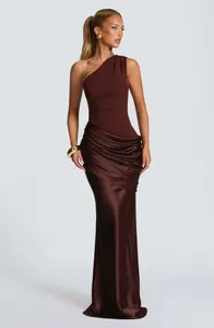 Elegant one-shoulder brown satin maxi dress featuring a sophisticated draped waist design detail.