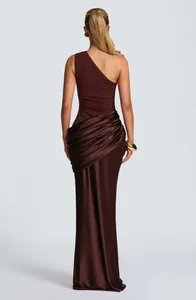 Back view of elegant brown one-shoulder satin maxi dress with draped wrap detailing.