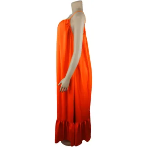 Side view of a bright orange sleeveless camisole maxi dress featuring a ruffled hem