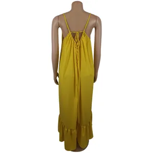 Back view of a yellow spaghetti strap maxi dress with ruffled hem and tie detail