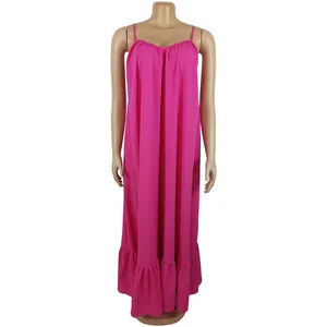 Full front view of a vibrant fuchsia pink camisole maxi dress with elegant ruffled hem