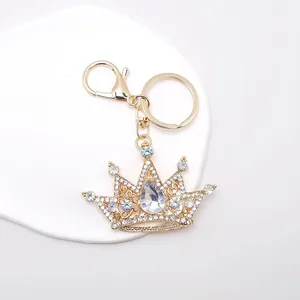Detail of golden crystal crown keychain with sparkling rhinestones and lobster clasp