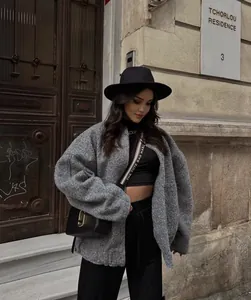 Stylish grey textured boucle jacket worn in a chic urban street style fashion look