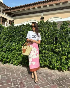 Elegant linen-blend floral printed midi skirt worn by model in an outdoor setting