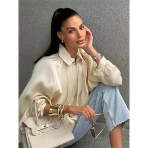 Elegant cream satin bomber jacket with luxury glossy finish for women's autumn fashion.