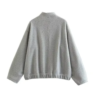 Back view of minimalist grey stand-collar jacket for women with textured fabric