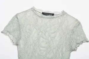 Close-up detail of a vintage style mint green lace short sleeve T-shirt for women