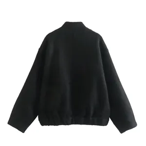 Back view of a minimalist black stand-collar jacket for women featuring an elastic hem