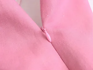 Detailed close-up view of pink linen blend skirt featuring a matching invisible zipper