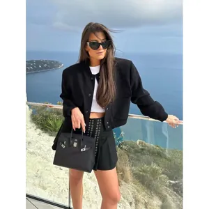 Modern stylish black women's stand collar jacket with large pockets and cropped fit