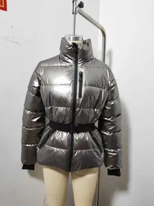 Metallic silver slim-fit puffer jacket with waist belt displayed on a mannequin indoors.