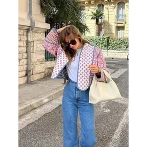 Bohemian reversible quilted jacket with floral print worn in a casual street style look