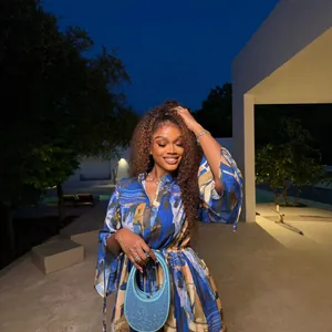 Elegant African style blue printed mini shirt dress with drawstring waist in night setting