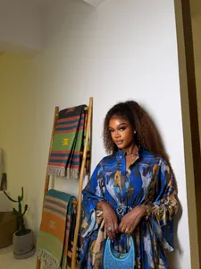 Close-up of African style printed mini dress with shirt collar and drawstring waist