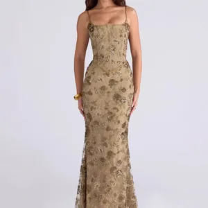 Close-up of intricate floral embroidery and sequins on elegant corset evening gown