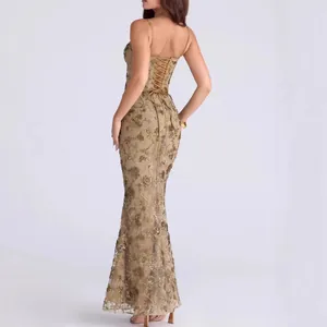 Back view of elegant gold floral sequin evening gown with corset lace-up back detail