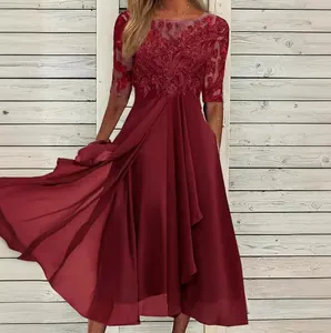 Close-up detail of wine red evening dress with lace bodice and chiffon skirt on model