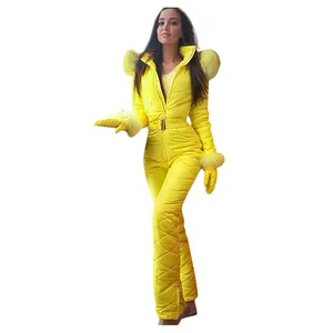 Detailed view of women's bright yellow one-piece ski suit with fur collar and gloves