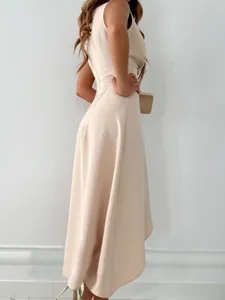 Elegant sleeveless midi dress in cream showing a refined side silhouette and smooth fit.