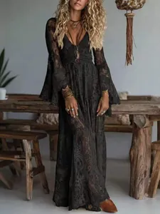 Elegant bohemian black lace V-neck maxi dress with long flare sleeves for vacation