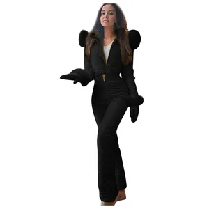 Close-up of waterproof black one-piece ski suit with quilted texture and accessories