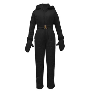 Detailed view of black quilted women's ski jumpsuit with belt and matching mittens