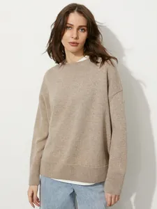 Stylish loose fit round neck knitted sweater for women in a warm oatmeal beige tone