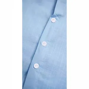 Close-up detail of light blue cotton linen shirt with white buttons and fabric texture