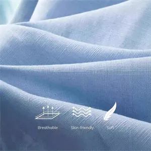 Macro detail showing the breathable, skin-friendly, and soft texture of blue cotton linen fabric