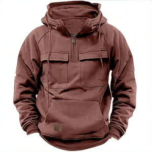 Detail of brown men's tactical hoodie with half-zip and multiple utility pockets