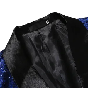 Close-up of blue sequin suit jacket with black satin lapel and interior lining