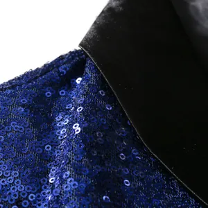 Close-up detail of blue sequins and black satin lapel on a men's performance blazer jacket