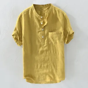 Detailed close-up showing the texture of a men's mustard yellow linen short sleeve henley shirt